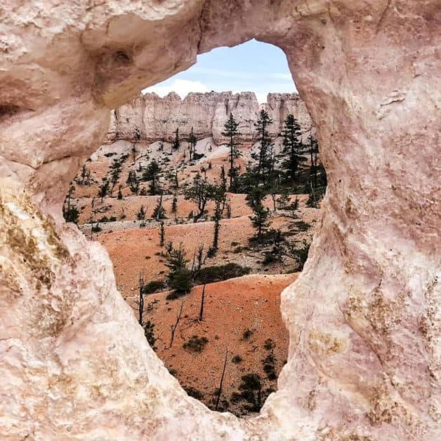 Hole in a rock overlooking Hoodoos in Bryce Canyon National Park 