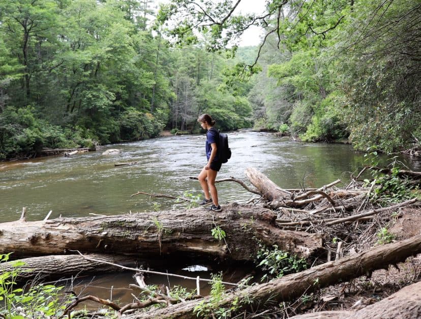 Girl crossing a river in Blue Ridge, GA
