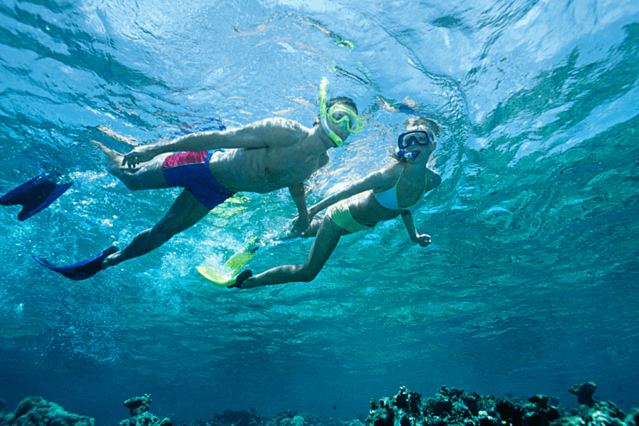 snorkeling in clear blue water 