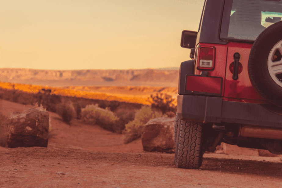 jeep on an off-roading trail in arizona at sunset