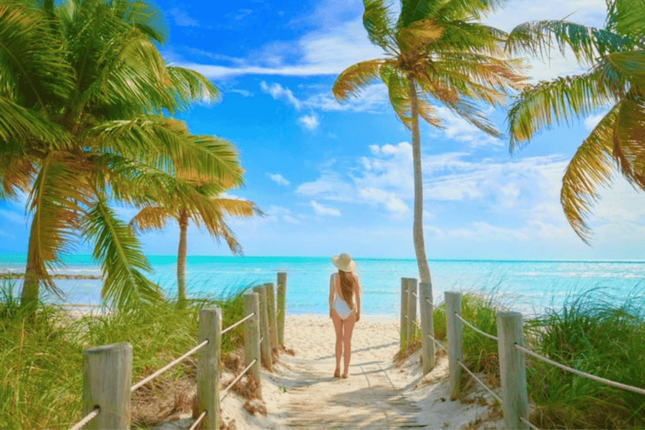 girl walking to the beach in key west during a mother daughter trip 
