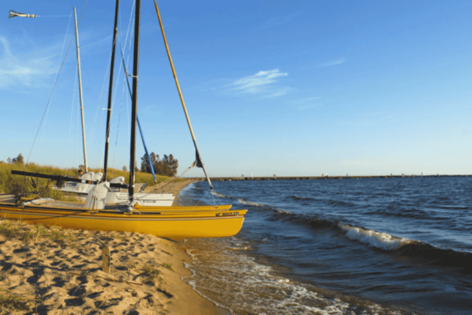 boats on a beach in muskegon, michigan in the summer
