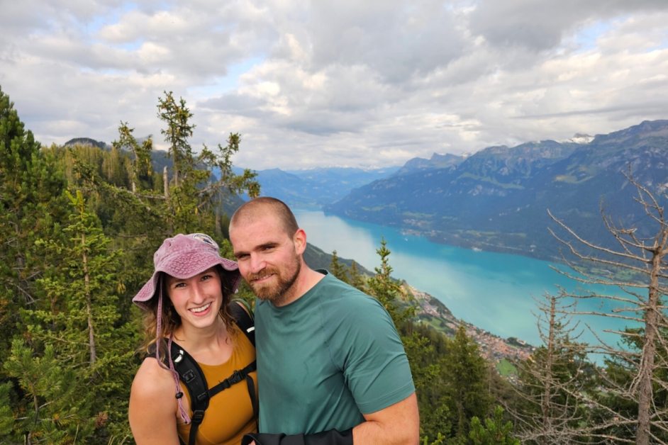 Day hiking packing list- water bladder- picture of two people hiking in switzerland.