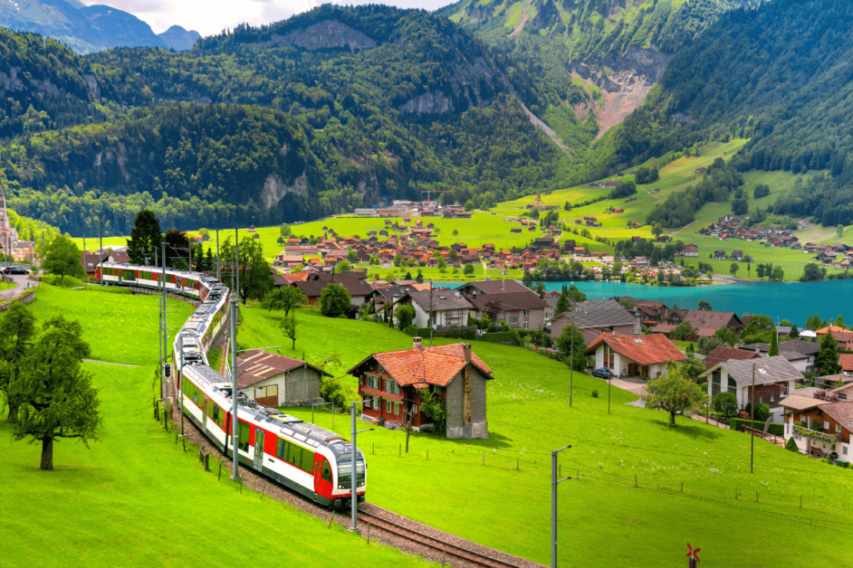 Train traveling through Switzerland in the summer months. 