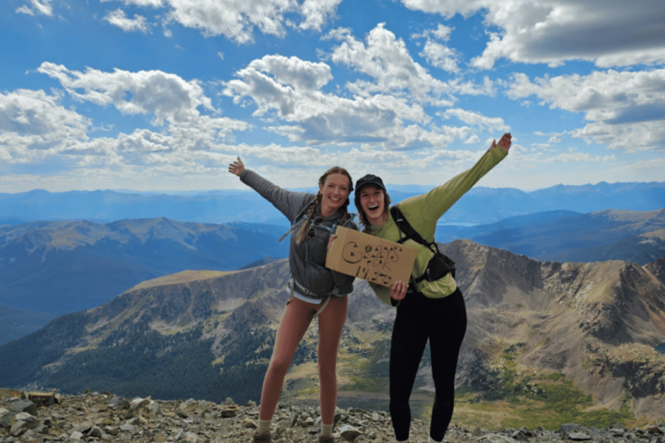 two people at the top of grays peak trail