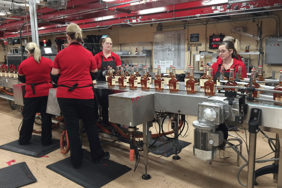 5 females behind the scenes at a distillery during a Kentucky Bourbon Trail tour. 