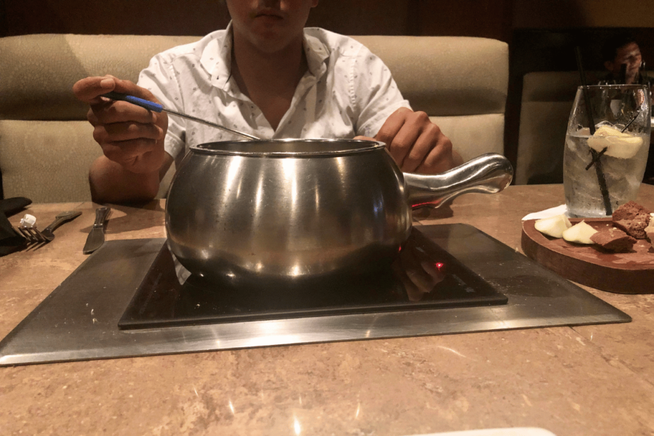 Cooking bread and meat at Orlando's Melting Pot restaurant.