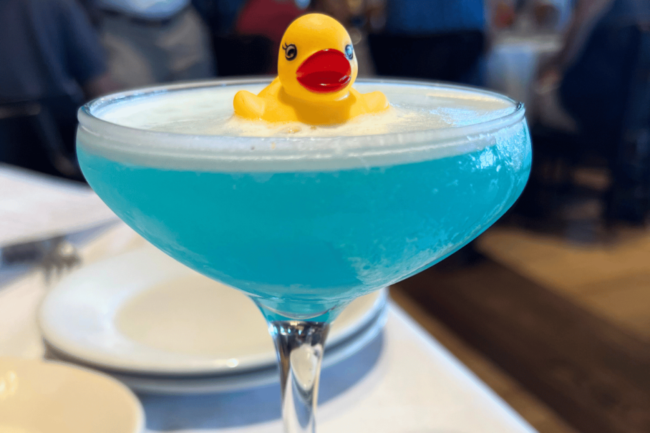 Close up image of the Duck Duck Razz drink at Disney Springs Boathouse restaurant during an Orlando date night. 