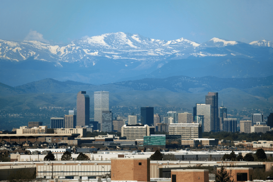 Denver Date Nights skyline with mountains in the background. 