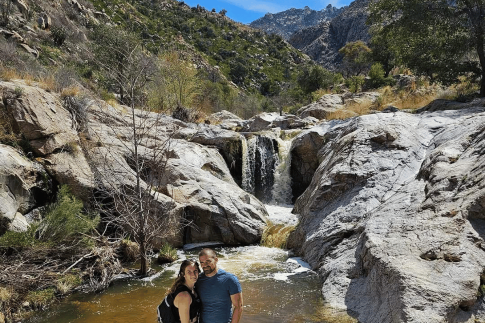 Couple standing in front of Romero Falls in Catalina State Park in Tucson. 