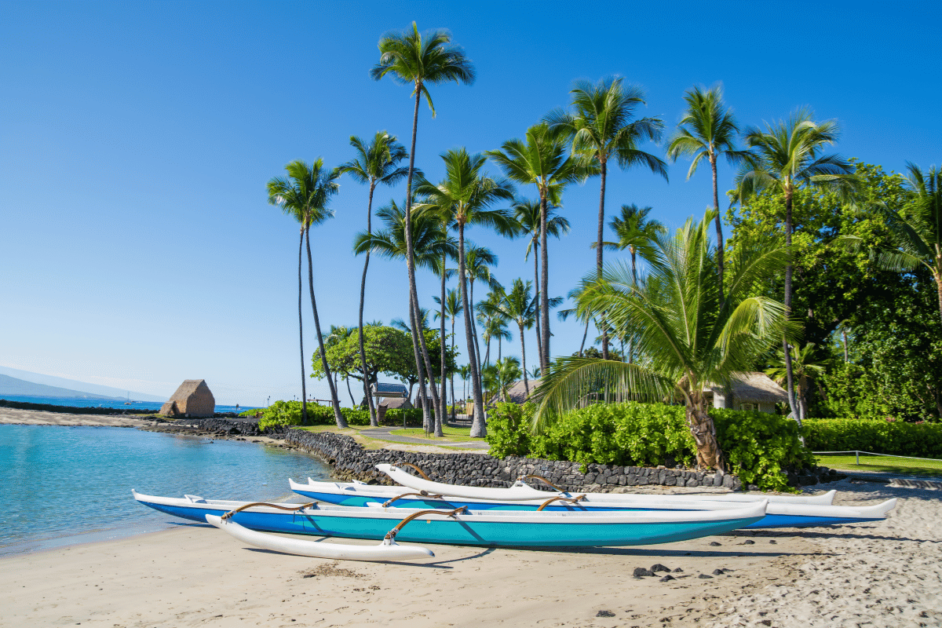 boats on the shore of a beach on the big island. 