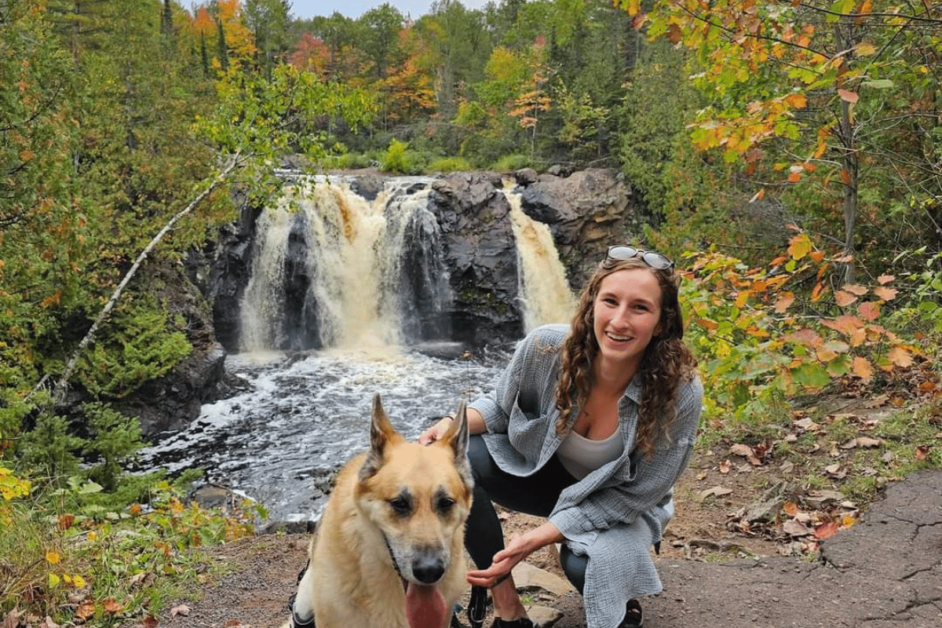 girl and dog near little manitou falls in Pattison Park Wisconsin. 