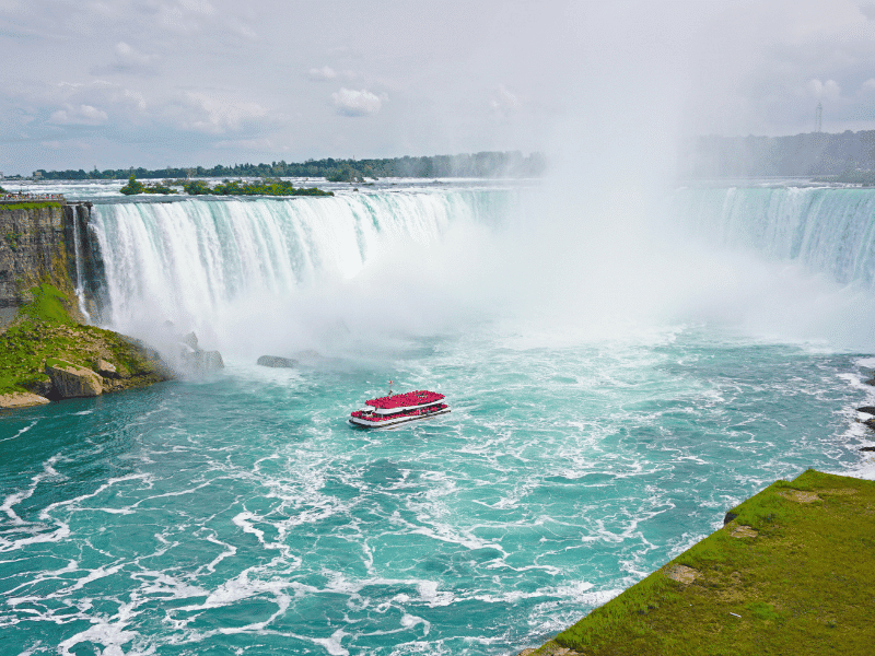 boat at the base of niagara falls. 