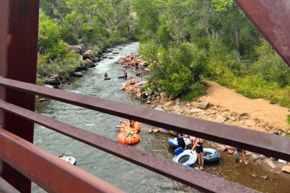 People tubing in Clear Creek River in Golden, Colorado.