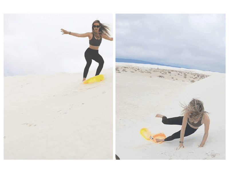 girl sledding on the dunes at white sands national park. 