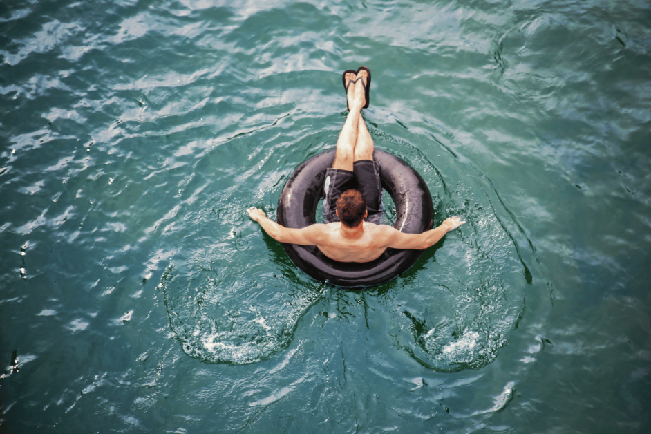 Man sitting in inflatable tube