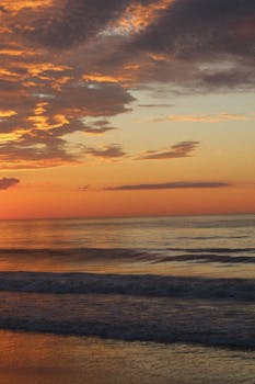 Experience the tranquil waves and vibrant sunset hues at Bethany Beach, Delaware.
